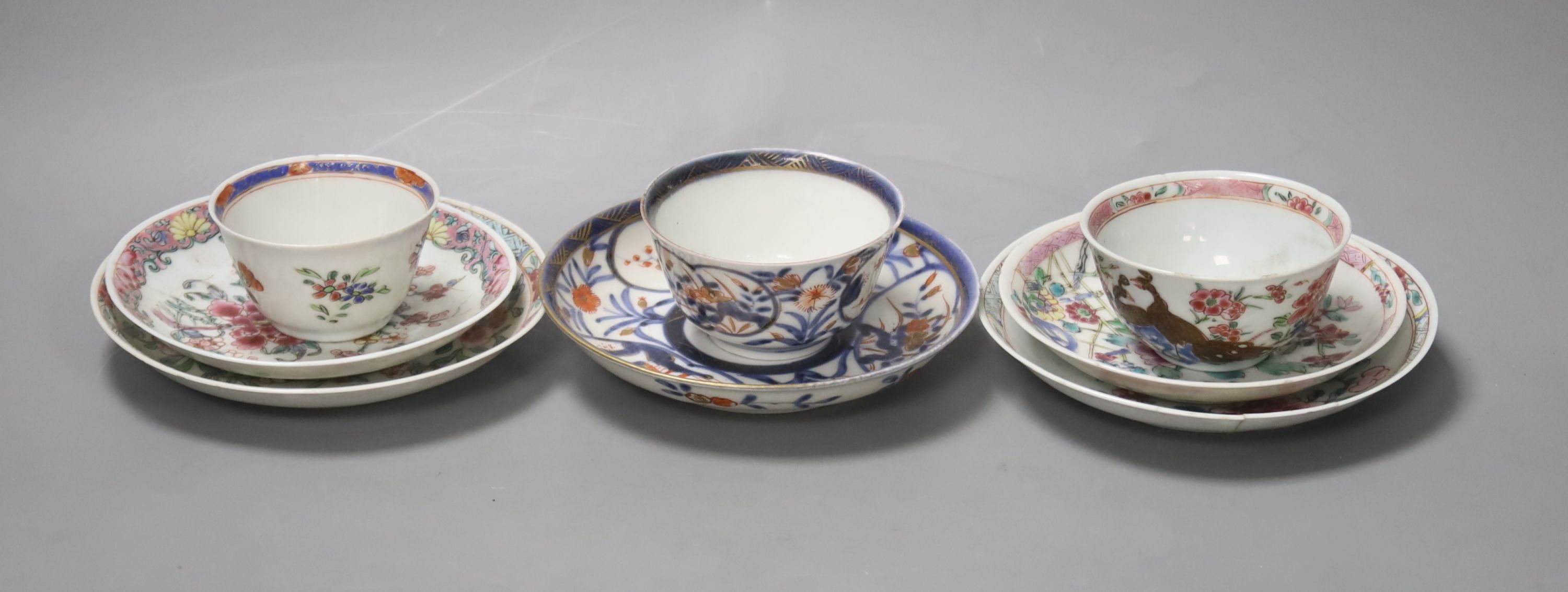 Three 18th century Chinese famille rose or Imari tea bowls together with five saucers